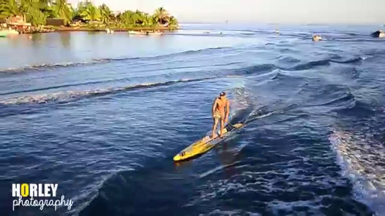 Surfing a Boat Wave in Teahupoo, Tahiti