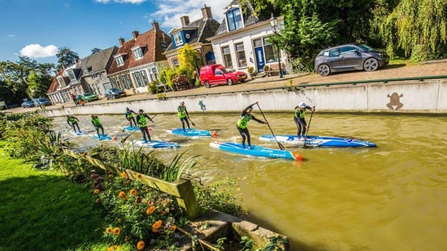 Daniel Hasulyo and his brother Bruno power through another canal at the 2017 SUP 11 City Tour in The Netherlands