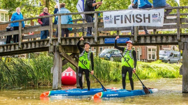 Daniel and Bruno Hasulyo passing the finish line at the 2017 SUP 11 City Tour in The Netherlands