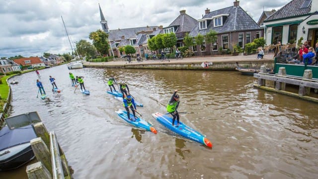 Daniel Hasulyo powers through a canal in Friesland, The Netherlands during the 2017 SUP 11 City Tour