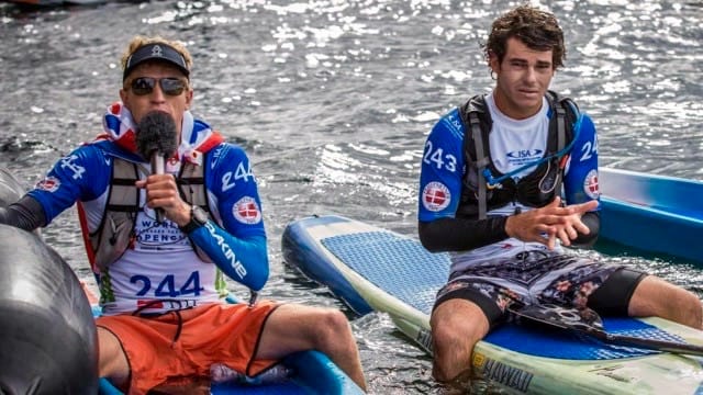 Connor Baxter gives interview, as Hawaii teammate Mo Freitas stares on