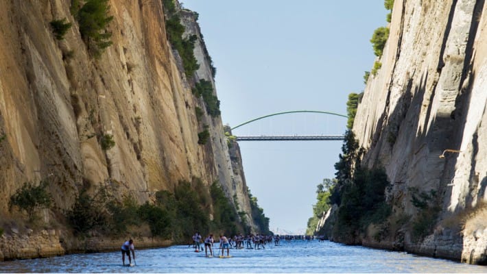 Participants make their way through the impressive depths of the Corinth Canal at the 7th Annual Corinth Canal SUP Crossing 2017 in Greece