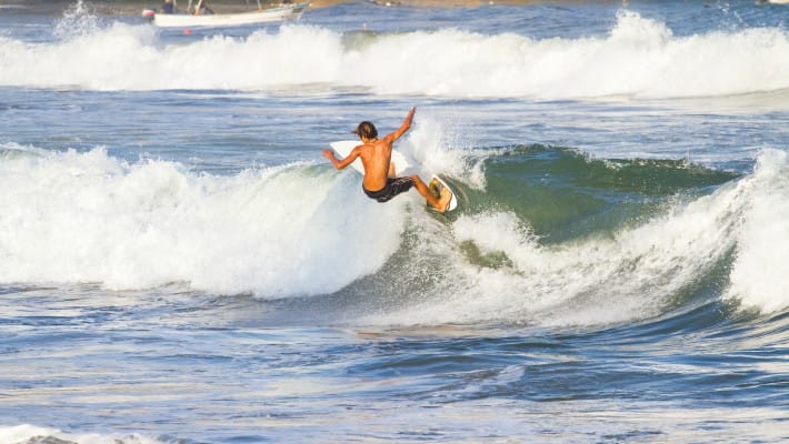 A youngster takes advantage of Sayulita's famously consistent wave conditions