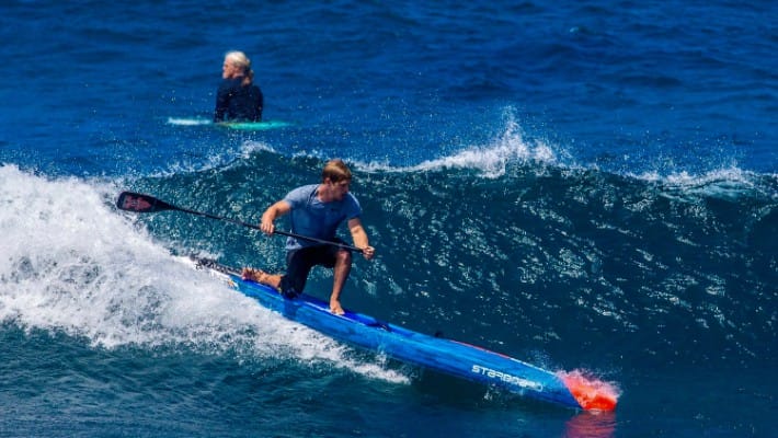 SUP rider Michael Booth takes on the waves during a Starboard SUP race session