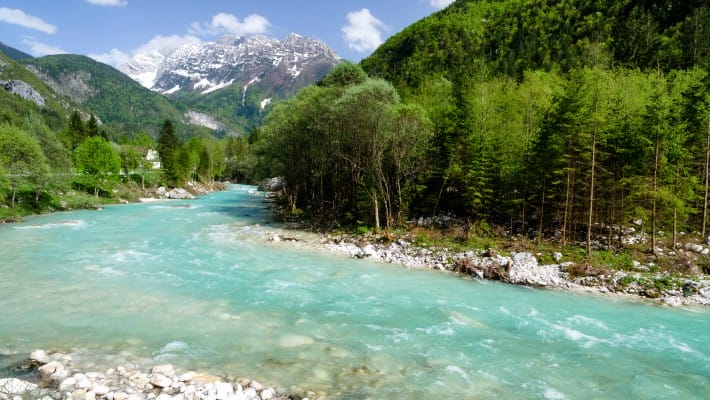 The clear blue waters if one of Slovenia's most treasured UNESCO World Heritage sites, the Soca River