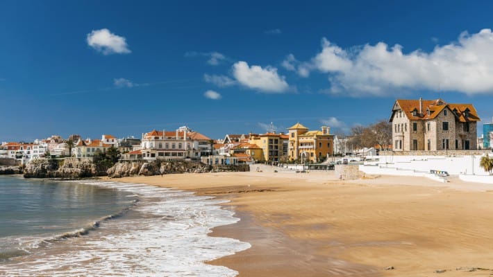 The waves gently roll in at the bay in Cascais, Portugal