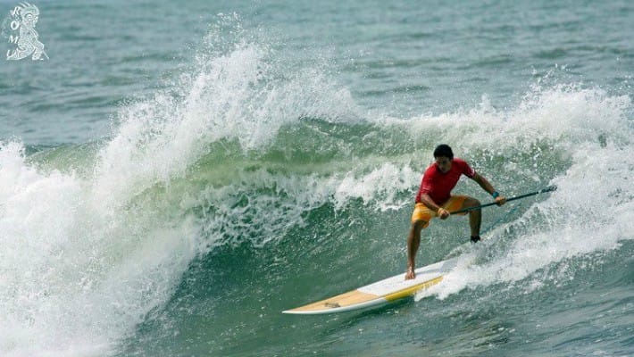 Tehotu Wong rides some waves in his homeland of Tahiti